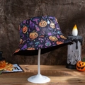 Detail showing Halloween bucket hat with pumpkin and mushroom patterns on a display stand - M (56-58cm) / Pumpkin Mushroom