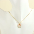Detailed close-up of a festive Christmas wreath pendant on a gold chain necklace for women - Flower Garland