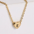 18k gold plated heart necklace with engraved letter E on a minimalist stone background - Letter E