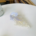 Detail of jellyfish-shaped acetate hair claw with iridescent finish and gold accents - Approx. 13cm / Pearlescent White