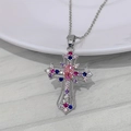 Detailed macro view of silver cross pendant featuring colorful zircon stones and fine chain - Necklace / Silver Multicolor Zirconia