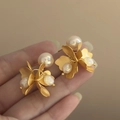 Close-up of vintage golden flower earrings with layered petals and glossy pearls - 925 Silver Needle Style (48#)