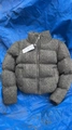 Detail showing the gray knitted texture and high neck design of this winter jacket - XS / Gray