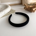 Detail of handmade black fabric sponge headband with woven interior label - Black