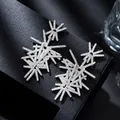 Sparkling S925 silver snowflake earrings with fireworks star design on black jewelry box - Radial Starburst Earrings