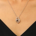 Silver heart projection necklace featuring 100 languages of I Love You on a model - Silver Projection Style (N-822)