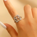 Macro shot of silver geometric square ring with hammered texture on a model's finger - Geometric Hollow Hammered Silver Ring (0659) / Silver