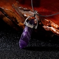 Natural purple amethyst hexagonal crystal bullet pendant necklace on a wooden base - Amethyst