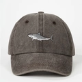 Close-up of shark embroidery on a vintage washed dark grey cotton baseball cap - Coffee