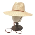 Classic wide-brim straw hat with brown leather band and chin strap on a mannequin - One Size / Light Wood Color
