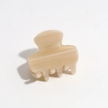 Close-up of cream leopard print hair claw clip with glossy resin texture and metal spring - Khaki
