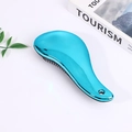Blue metallic detangling hairbrush with an ergonomic handle on a minimalist white desk - Electroplated Peacock Blue