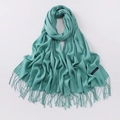 Soft turquoise cashmere scarf featuring long tassels and an authentic textile label - Emerald Blue