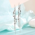 Elegant long silver tassel earrings with moon and star accents in a stylish linear design - Lip Chain Wave Ear Threader