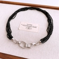 Detail of layered black beaded necklace with vintage silver industrial textured clasp - Black