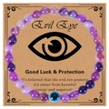 Dettaglio del bracciale occhio del male viola su carta regalo con testo spirituale - Bracciale in Pietra a Righe Viola