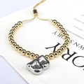 Detail of adjustable gold beaded bracelet featuring a silver 3D balloon letter B charm - Letter B