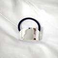 Minimalist elastic hair tie featuring a polished silver metallic curved plate accent - Silver Curved Style