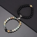 Detail of natural stone couple bracelets with heart-shaped magnetic clasp and matte beads - Amazonite & Frosted Black With White Heart Magnet