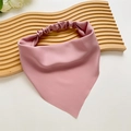 Detailed view of pink satin hair bandana with elastic band on a wooden tray - Pink