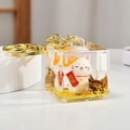 Golden liquid sand Maneki Neko keychain featuring a lucky white cat in acrylic cube - Lucky Cat (Blessing)