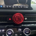 Car air vent aromatherapy clip featuring a decorative red rose flower design in car interior - Red Ranunculus Flower (No Scent)