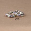 Macro shot of 6mm silver hoop earrings with multi-colored cubic zirconia gemstones - 6mm / Silver