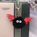 Halloween black faux mink fur bat keychain with red glitter wings on a handbag - Gold Chain / Black & Red Wings