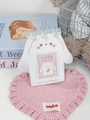 Close-up of a white bunny-shaped PVC desk calendar photo album with rings - White Rabbit