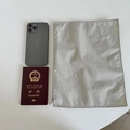 Detailed view of the gray nylon fabric and smooth zipper closure of the portable organizer bag - 30*23 / Light Gray
