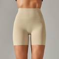 Detail view of high waisted seamless yoga shorts with nude tone matte compression fabric - Light Apricot