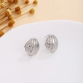 Macro shot of silver textured triangular heart earrings on a white display with dried flowers - Silver Pleated Shell (E7122)