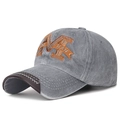 Washed grey baseball cap with orange M embroidery and brown leather trim detailing - Gray