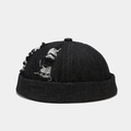 Close-up of distressed denim fabric and ripped details on a black miki hat - Adjustable / Distressed Black Denim