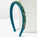Close-up of Baroque sponge headband with peacock blue silk and luxury green crystals - Green