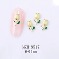 Detail of tulip nail art charm MZH-8517 with yellow petals and green leaves on pink nail - Pale Yellow Tulip Gold Base (8517)