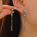 Antique silver drop earrings with light blue gems and long metallic pendants on model - Sapphire Chain Dangle Style (9862) / Gunmetal Blue