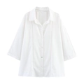 Detail of white linen shirt showing lace trim, buttons, and breathable fabric texture - XS / Tops / White