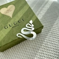 Close-up of a silver snake-shaped ornament on a floral embossed green gift box - Snake Christmas Tree Style 2 / 1.3mm / Silver