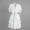 Vista frontale del set bianco 2 pezzi con top a sbuffo e gonna a balze stratificate - S / Bianco Sporco