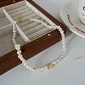 Detail of irregular freshwater pearl necklace with gold heart pendant on white surface - 19# Gold Irregular Pearl Heart Necklace