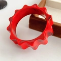Fashionable red and black marble resin bangle with unique wavy gear-like serrated design - Red
