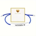 Detail of blue woven bracelet with engraved silver metal bar and inspirational gift card - Just Breathe Silver Bar Royal Blue Rope With Card