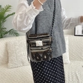 Detail of plush heart-shaped crossbody bag with boho pattern on a soft fleece texture - Ethnic Style Stripes