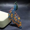 Detailed peacock brooch featuring vibrant blue and green crystals in gold alloy setting - YNCP6639 Peacock / 45*108mm / Multicolor Blue