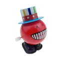 Dettaglio di un giocattolo a molla con cappello a stelle e strisce e grandi denti - Clown Rosso con Cappello Stellato