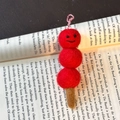 Handmade wool felt tanghulu pendant keychain featuring three red balls and a cotton string - Sugar Coated Haws