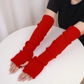 Pair of red knitted long arm warmers for women with ribbed texture for winter comfort - One Size / Red