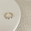 Adjustable golden ring with blue and white checkered pattern on a ceramic tray - JZ6004 Gold Blue White Checkerboard Ring