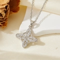Détail d'un pendentif étoile à quatre branches en argent avec incrustations de zircons blancs - Collier Étoile Entièrement Sertie de Zircon Argenté T018